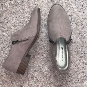 Light tan/cream color, zip up on the sides